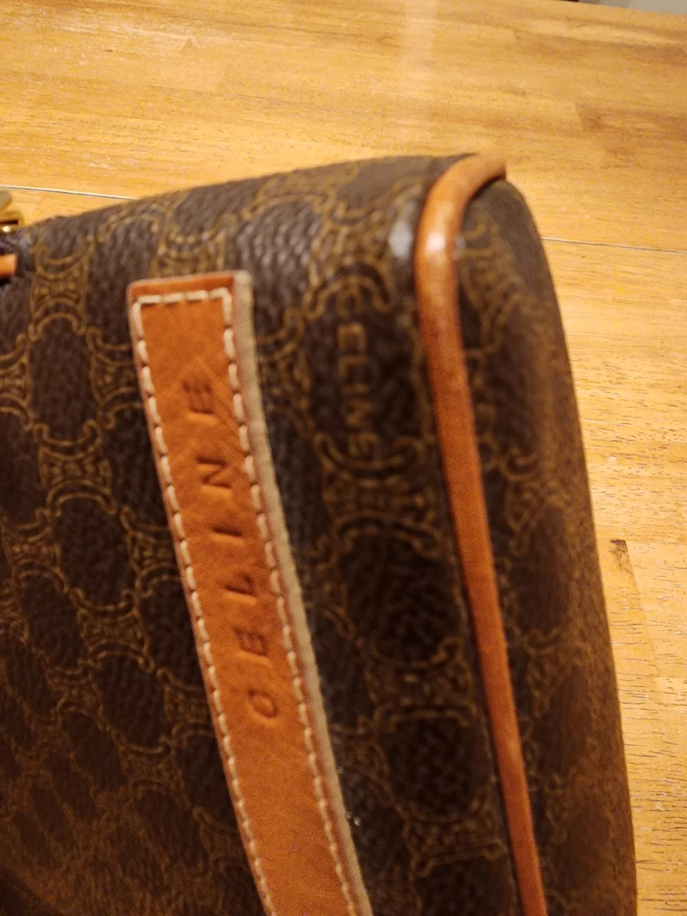 CELINE pouch is crafted from brown Triomphe canvas and features tan leather trim